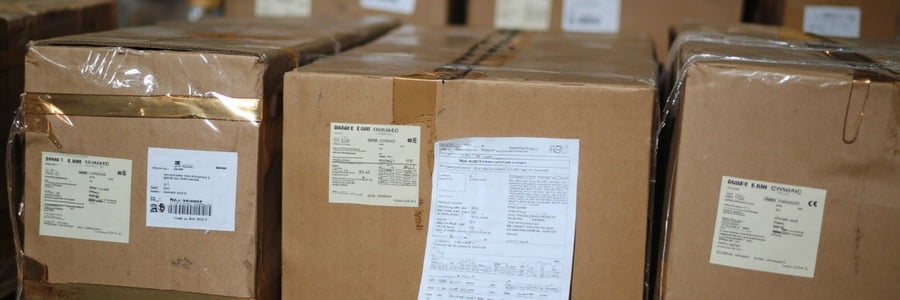 Packed excavator spare parts with carton labels and packing list