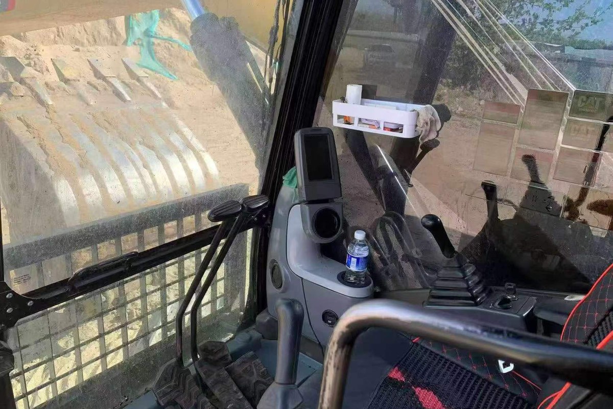 CAT 320D2L cab controls photo for operator area evidence
