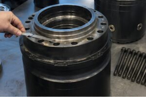 Volvo excavator final drive old unit inspection on workbench