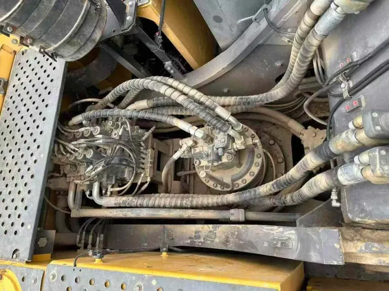Hydraulic hose and pump inspection on used Volvo excavator