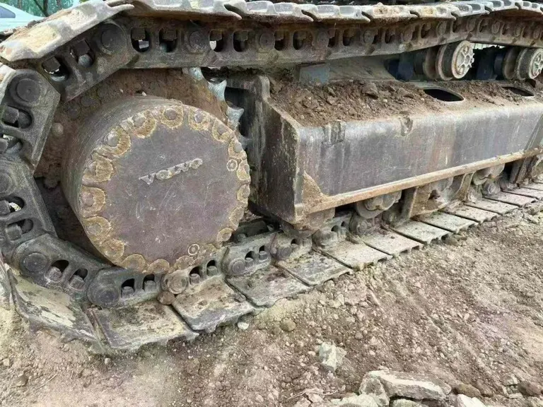 Undercarriage track and roller inspection on used excavator