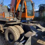 Doosan DX210W cab exterior, tires and stabilizer