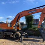 Refurbished Doosan DX210W wheeled excavator, full side view in Baoding, China