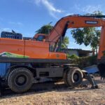 Refurbished Doosan DX210W wheeled excavator side and rear quarter view