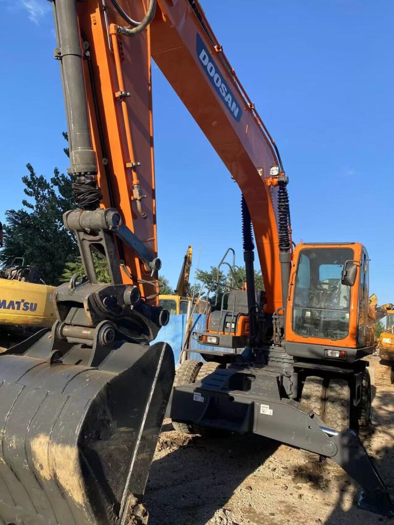 Front view of the refurbished Doosan DX210W wheeled excavator with boom and bucket